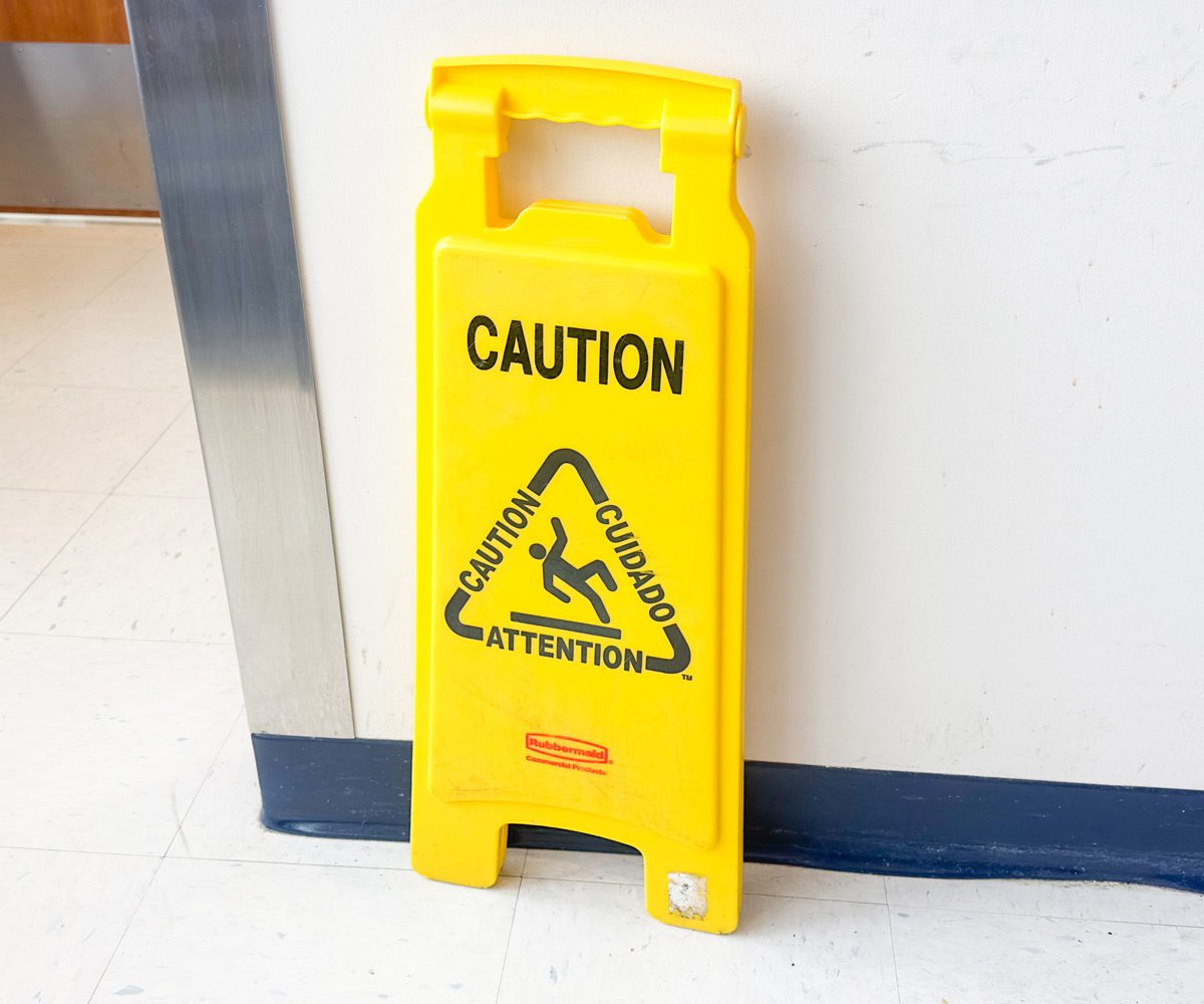 Wet-floor-sign-posted-to-prevent-OSHA-violation