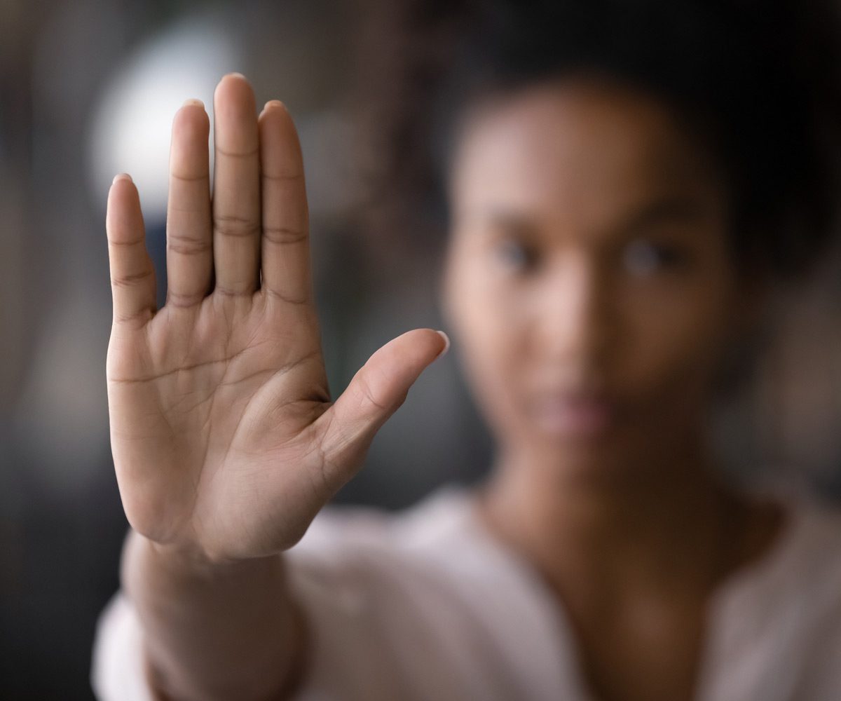 Woman-holding-up-her-hand-against-sexual-harassment