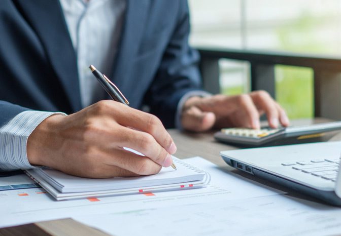 Accountant-calculating-employee-benefits-in-compliance-with-ERISA Accountant-calculating-employee-benefits-in-compliance-with-ERISA