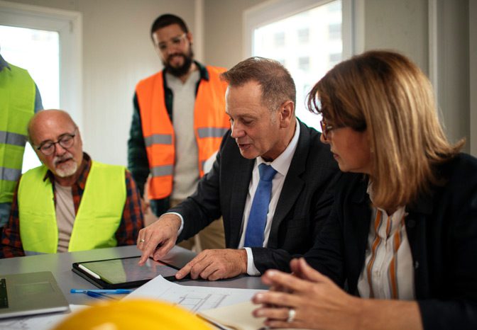 Business-owners-holding-a-meeting-to-prevent-OSHA-violations Business-owners-holding-a-meeting-to-prevent-OSHA-violations