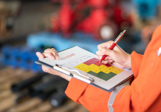 Manager-reviewing-workplace-safety Manager-reviewing-workplace-safety