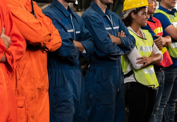 Private-sector-labor-employees-standing-in-a-line-with-folded-arms Private-sector-labor-employees-standing-in-a-line-with-folded-arms