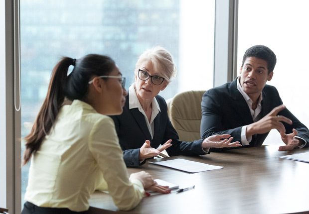 Whistleblowing-employee-experiencing-retaliation-from-management-during-meeting Whistleblowing-employee-experiencing-retaliation-from-management-during-meeting