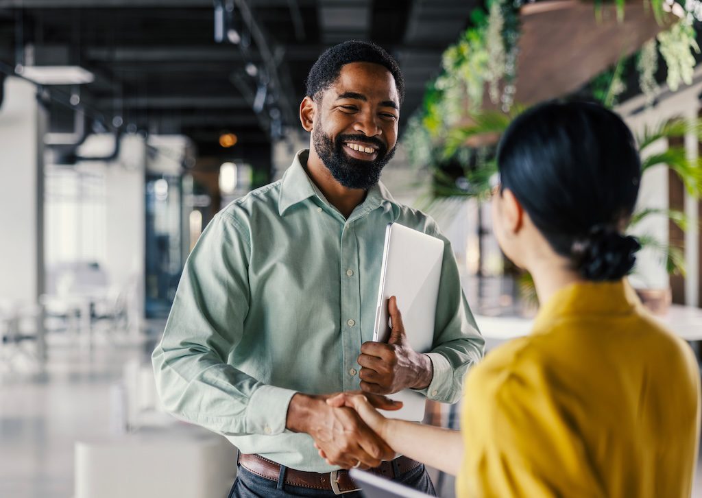 man-and-woman-talking-in-an-open-office