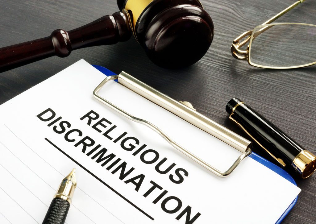 clipboard-labeled-religious-discrimination-on-a-desk-with-a-gavel-and-pen