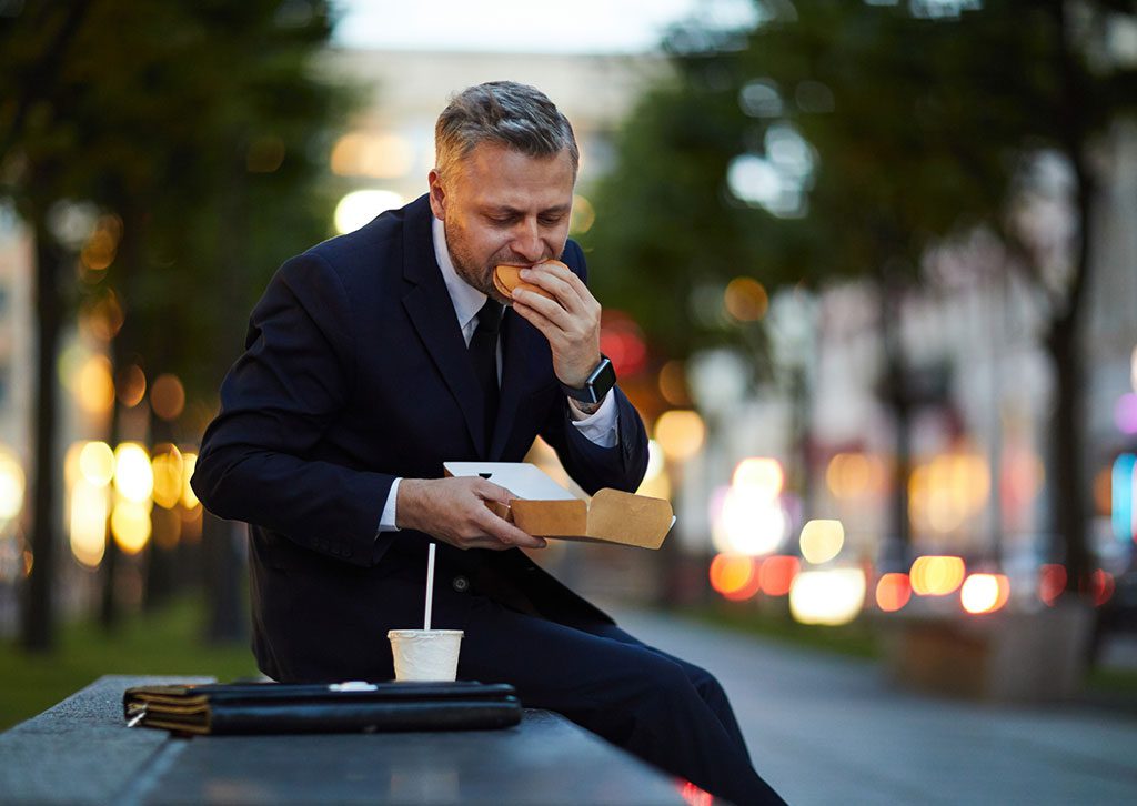 man-sitting-outside-with-food