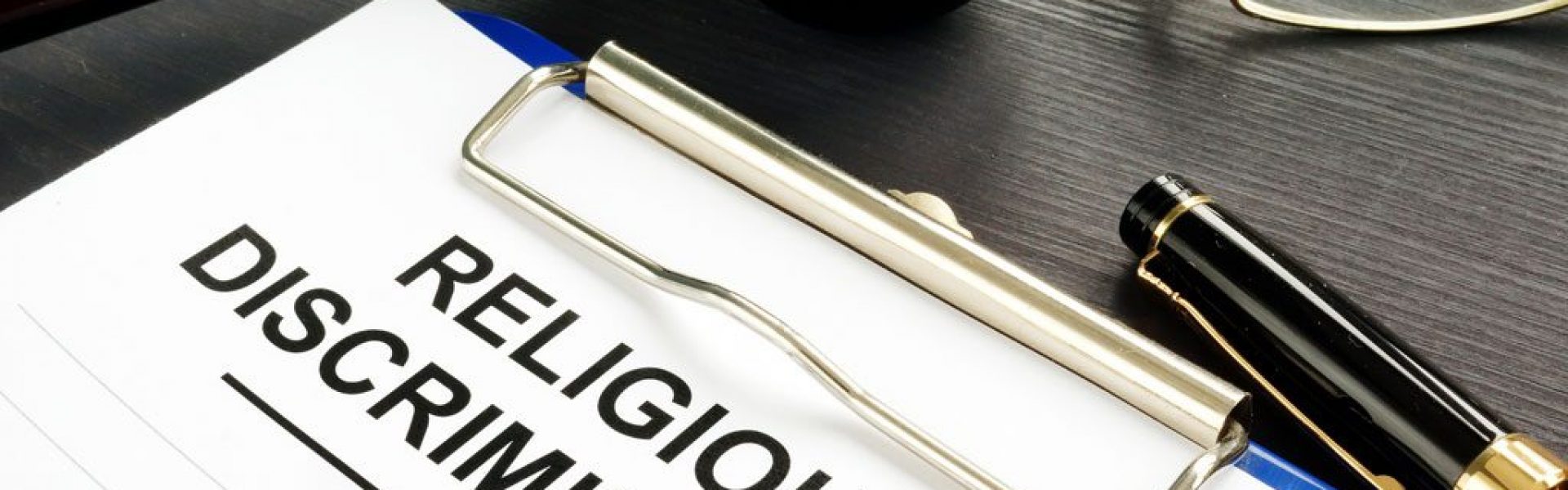 clipboard-labeled-religious-discrimination-on-a-desk-with-a-gavel-and-pen