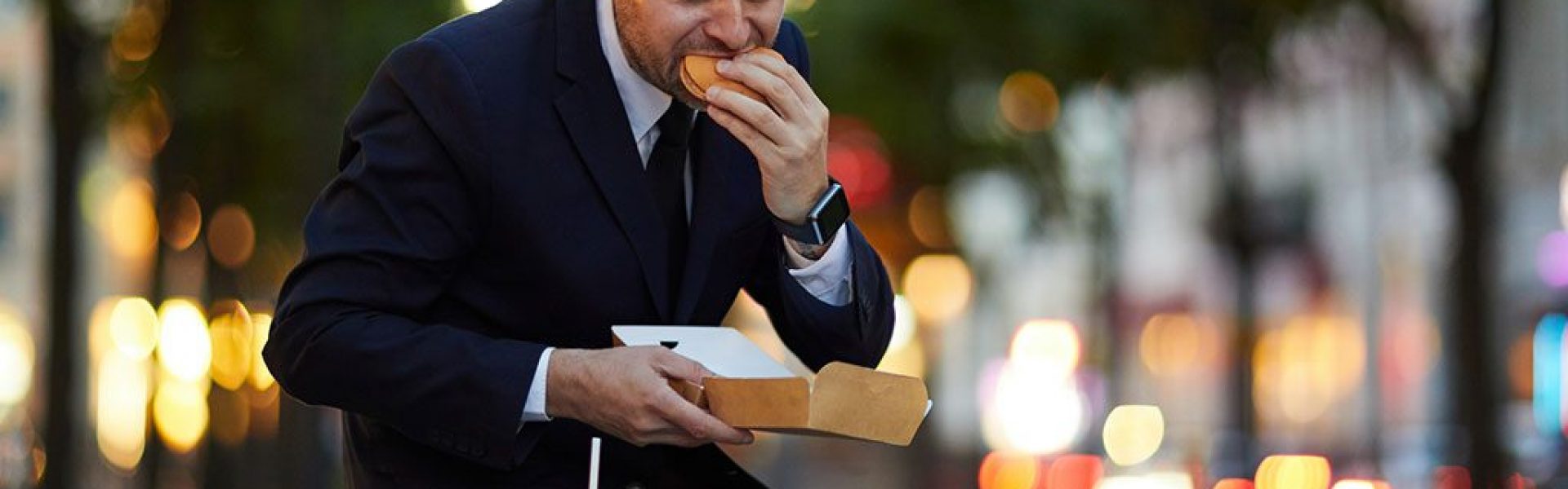 man-sitting-outside-with-food